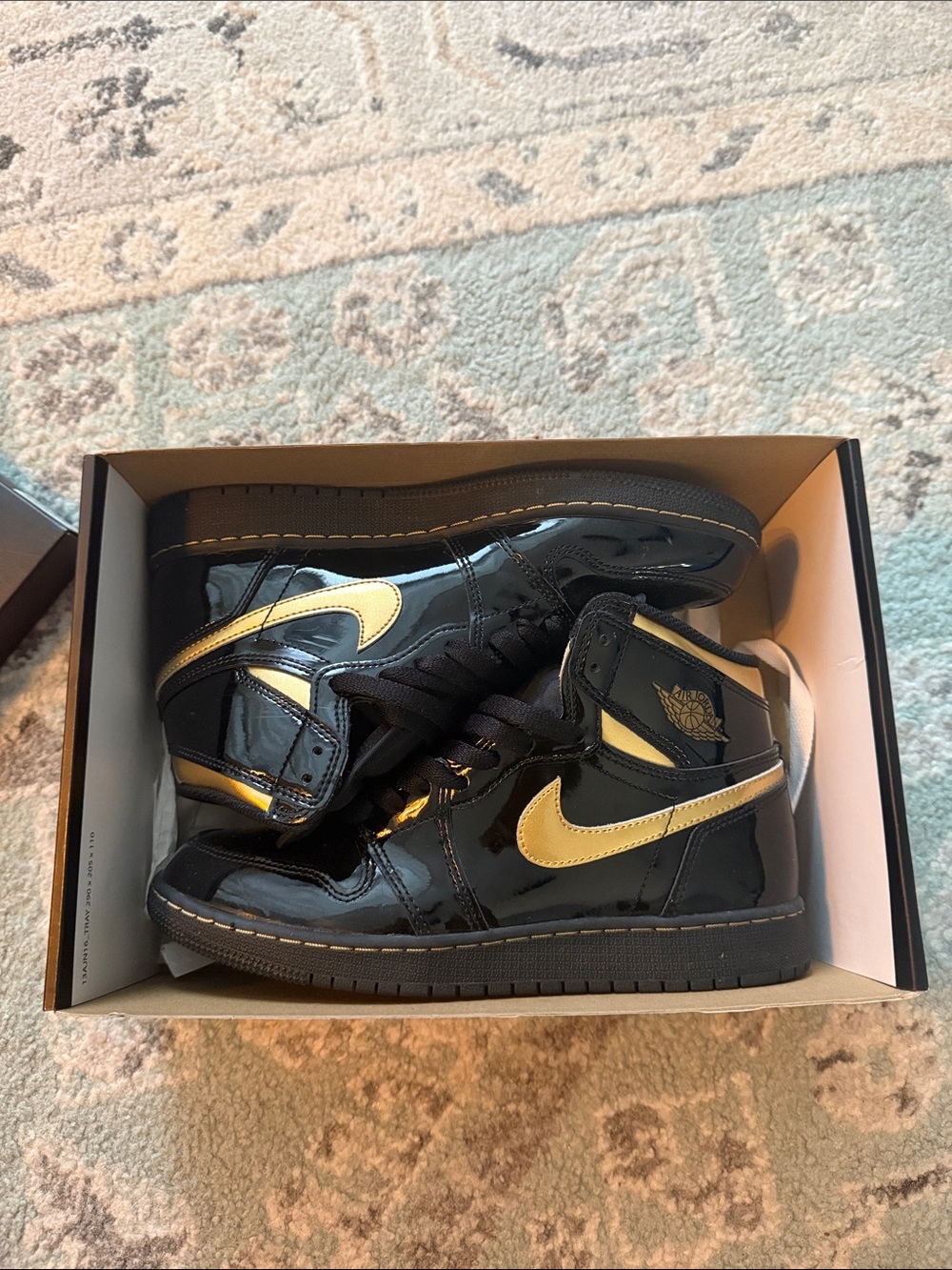 Nike Black Patent High-Top Sneakers with Gold Swoosh